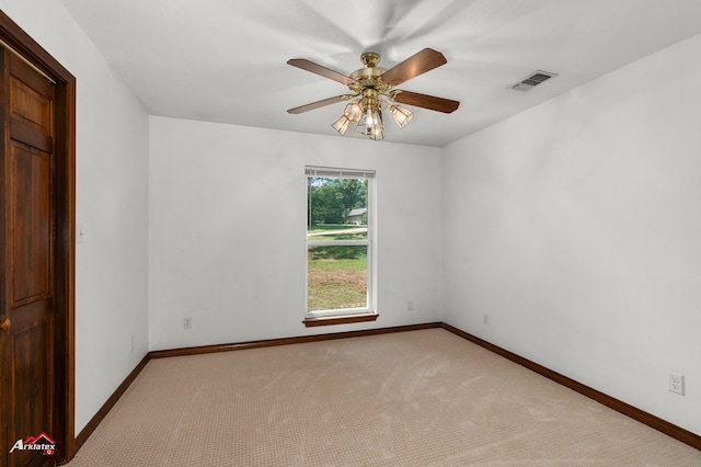 806 Cartwright, San Augustine, TX 75972 - unfurnished room featuring ceiling fan, light carpet, and baseboards