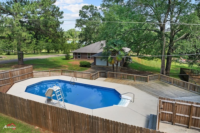 806 Cartwright, San Augustine, TX 75972 - view of pool with a wooden deck and view of scattered trees