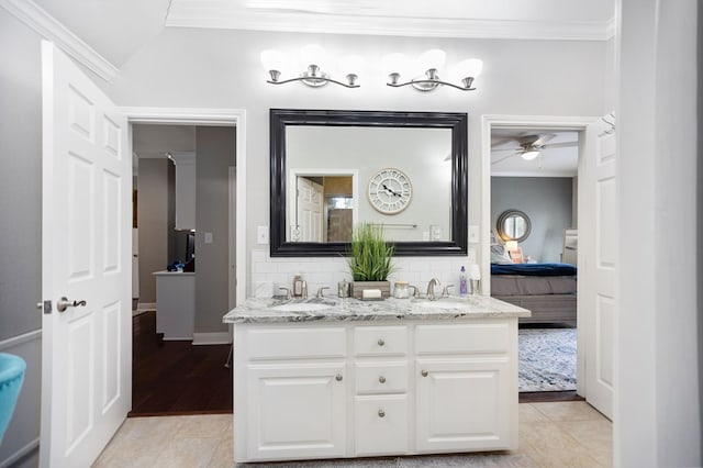 486 Brookwood Dr, Diboll, TX 75941 - ensuite bathroom featuring crown molding, double vanity, ceiling fan, connected bathroom, and a sink