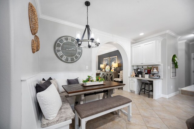 486 Brookwood Dr, Diboll, TX 75941 - dining area with an inviting chandelier, ornamental molding, recessed lighting, arched walkways, and light tile patterned floors