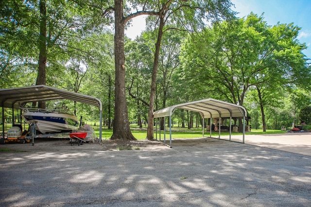 486 Brookwood Dr, Diboll, TX 75941 - view of car parking with a carport