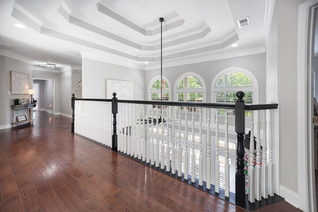 486 Brookwood Dr, Diboll, TX 75941 - hallway with crown molding, baseboards, wood finished floors, a tray ceiling, and visible vents