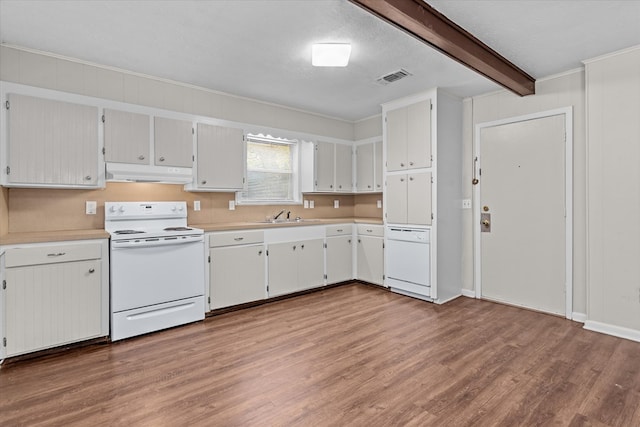 kitchen with beamed ceiling, wood-type flooring, a textured ceiling, and electric stove