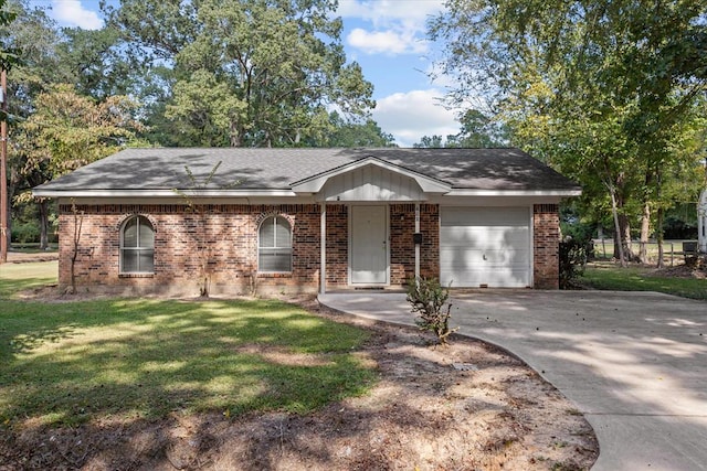 single story home featuring a garage and a front lawn