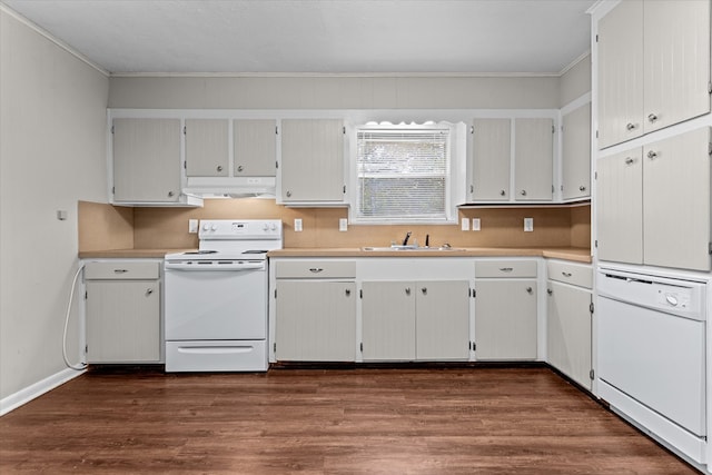 kitchen featuring dark hardwood / wood-style flooring, white appliances, and crown molding