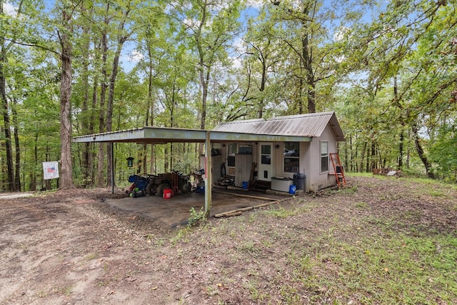 exterior space with a carport