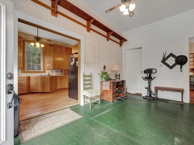 interior space featuring ceiling fan and dark wood-type flooring