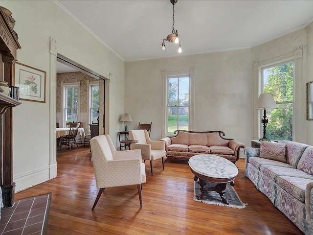 living room featuring wood-type flooring and ornamental molding