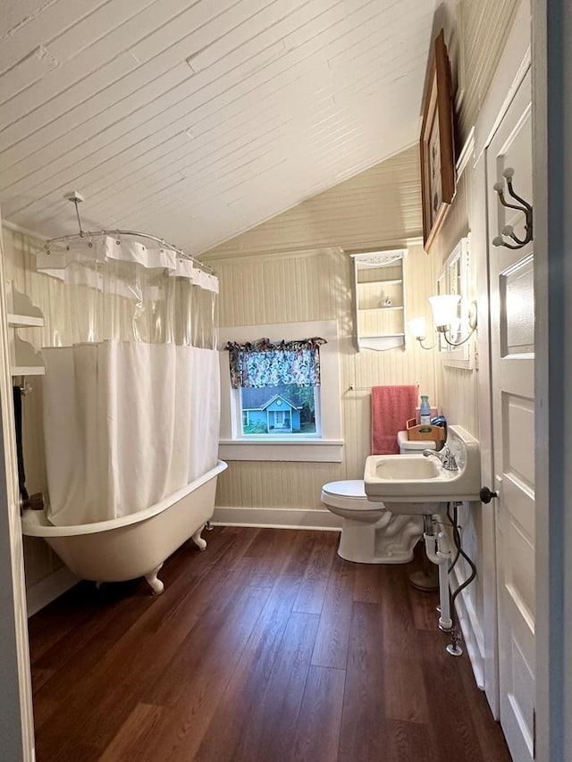 bathroom featuring hardwood / wood-style floors, wooden walls, vaulted ceiling, toilet, and wood ceiling