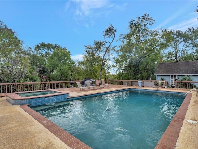 view of pool featuring an in ground hot tub and a patio