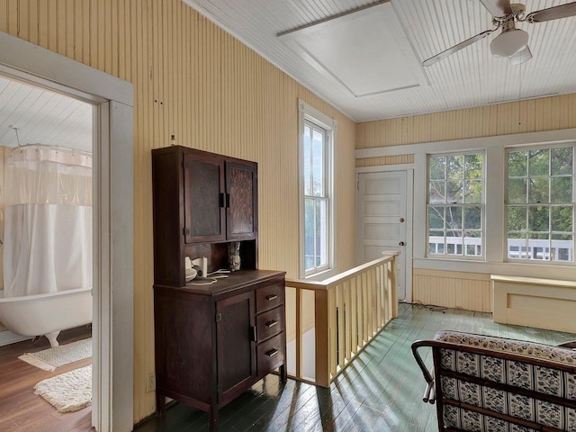 interior space with radiator and ceiling fan