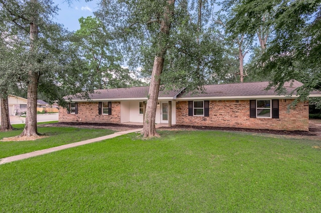 1311 Walnut Bend Dr, Lufkin, TX 75904 - ranch-style house featuring a front lawn and brick siding