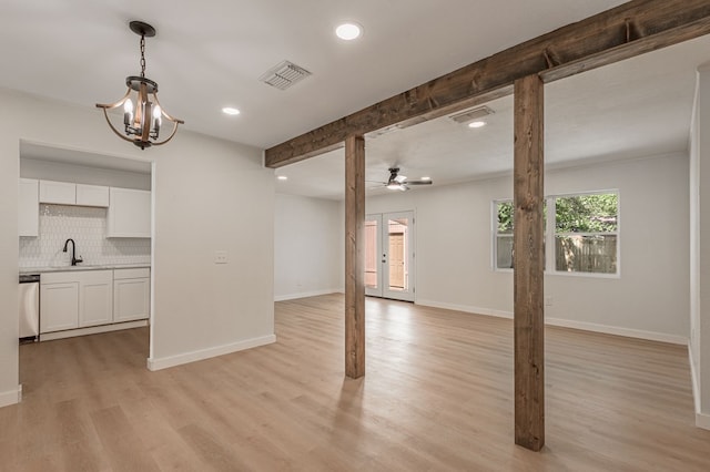 1311 Walnut Bend Dr, Lufkin, TX 75904 - unfurnished living room with a ceiling fan, recessed lighting, light wood-type flooring, a chandelier, and beamed ceiling