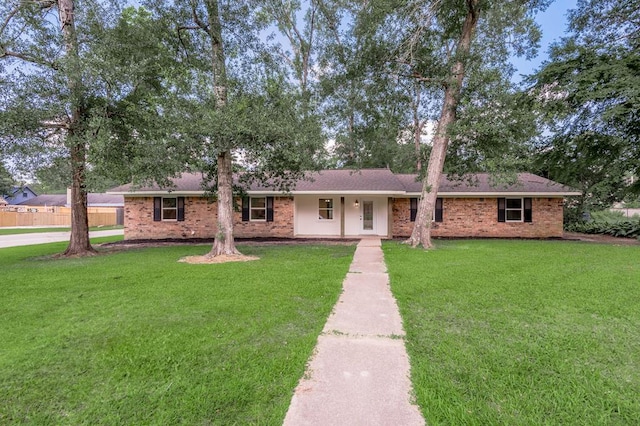 1311 Walnut Bend Dr, Lufkin, TX 75904 - ranch-style home featuring a front lawn and brick siding