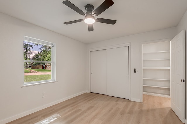 1311 Walnut Bend Dr, Lufkin, TX 75904 - unfurnished bedroom with light wood-style flooring, a closet, and ceiling fan