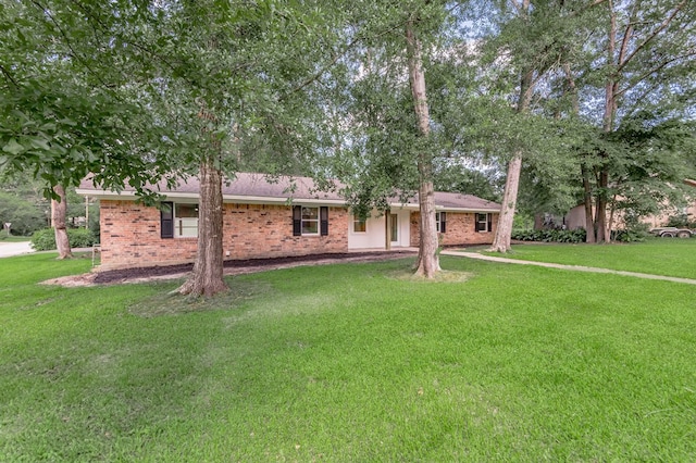1311 Walnut Bend Dr, Lufkin, TX 75904 - ranch-style house with brick siding and a front lawn