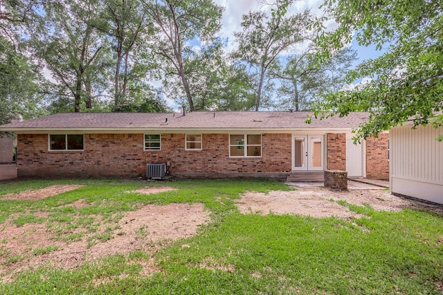 1311 Walnut Bend Dr, Lufkin, TX 75904 - rear view of house featuring french doors, a yard, and brick siding