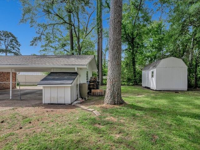 1304 Walnut Bend Dr, Lufkin, TX 75904 - view of yard with a storage unit and an outbuilding