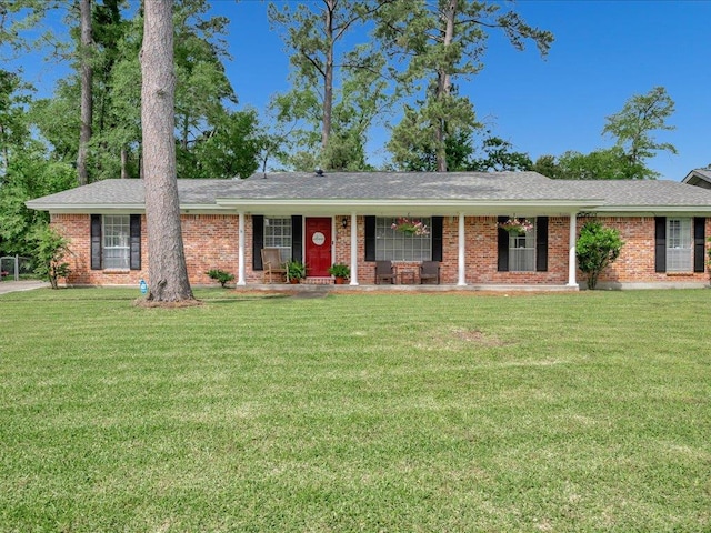 1304 Walnut Bend Dr, Lufkin, TX 75904 - ranch-style home with a front lawn, brick siding, and a shingled roof
