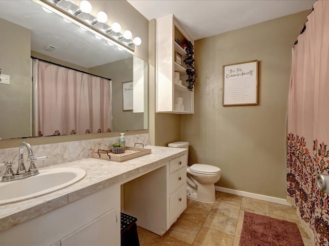 1304 Walnut Bend Dr, Lufkin, TX 75904 - bathroom with vanity, toilet, and baseboards