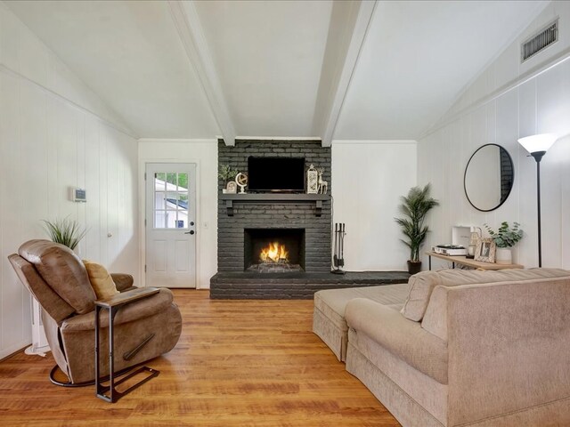 1304 Walnut Bend Dr, Lufkin, TX 75904 - living area with light wood finished floors, a fireplace, and a decorative wall