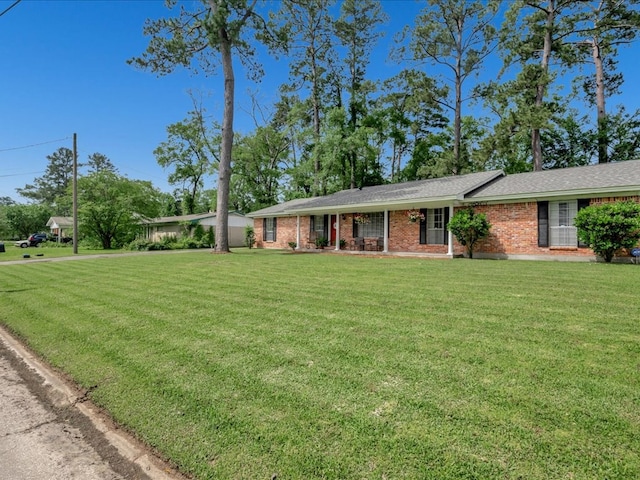 1304 Walnut Bend Dr, Lufkin, TX 75904 - single story home featuring a front yard and brick siding