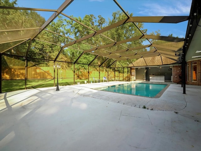 pool with a patio and a lanai