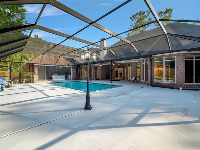 pool with a patio, french doors, ceiling fan, and a lanai