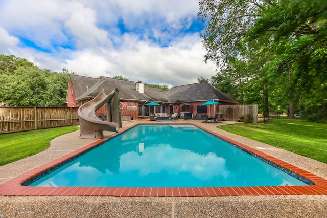 703 Shady Ln, Diboll, TX 75941 - view of pool with a water slide and a patio