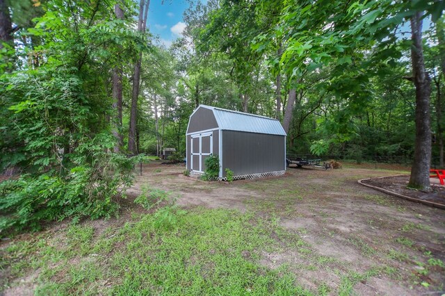 703 Shady Ln, Diboll, TX 75941 - view of yard with a storage shed and an outdoor structure