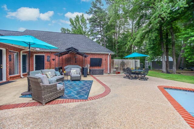 703 Shady Ln, Diboll, TX 75941 - view of patio with an outdoor living space with a fireplace