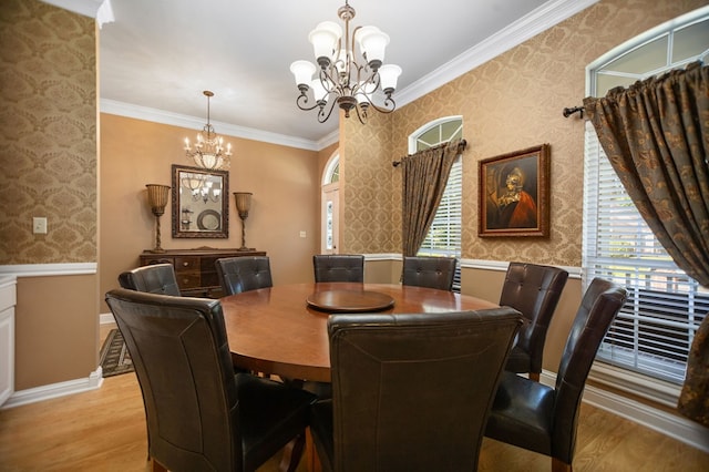 703 Shady Ln, Diboll, TX 75941 - dining room with a chandelier, wallpapered walls, light wood finished floors, crown molding, and a wainscoted wall