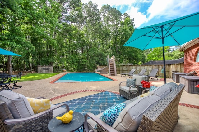 703 Shady Ln, Diboll, TX 75941 - view of pool featuring a water slide, an outdoor hangout area, a patio, and a fenced backyard
