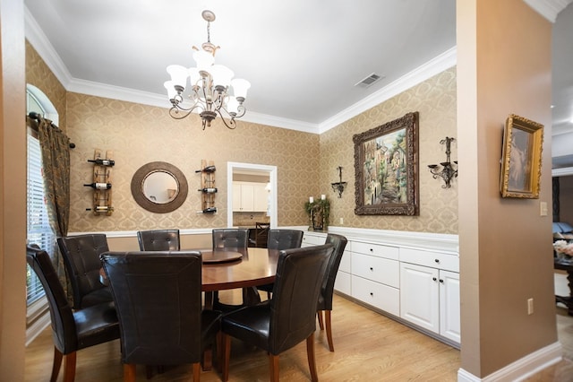 703 Shady Ln, Diboll, TX 75941 - dining space with crown molding, a chandelier, light wood-style floors, wallpapered walls, and wainscoting