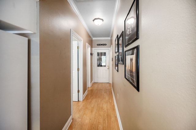 703 Shady Ln, Diboll, TX 75941 - hall featuring ornamental molding, light wood-style flooring, and baseboards
