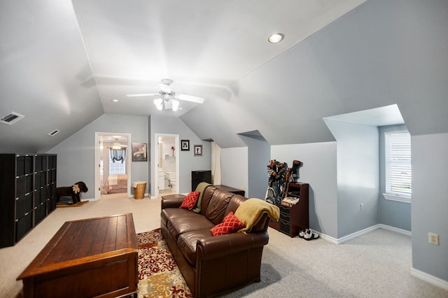 703 Shady Ln, Diboll, TX 75941 - carpeted living room featuring lofted ceiling, baseboards, and ceiling fan