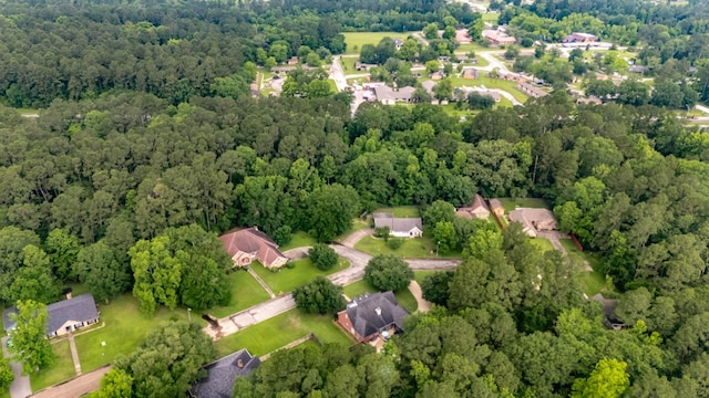 703 Shady Ln, Diboll, TX 75941 - aerial view of property and surrounding area with a heavily wooded area and nearby suburban area