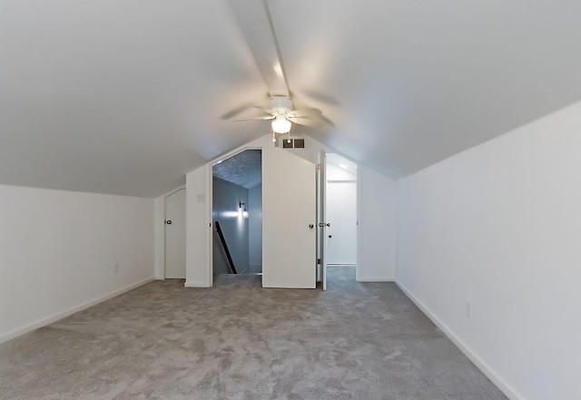 bonus room featuring ceiling fan, carpet, baseboards, vaulted ceiling, and visible vents