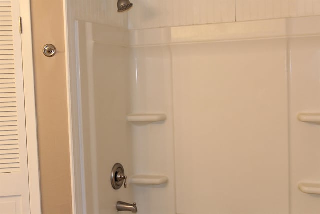 details featuring tub / shower combination