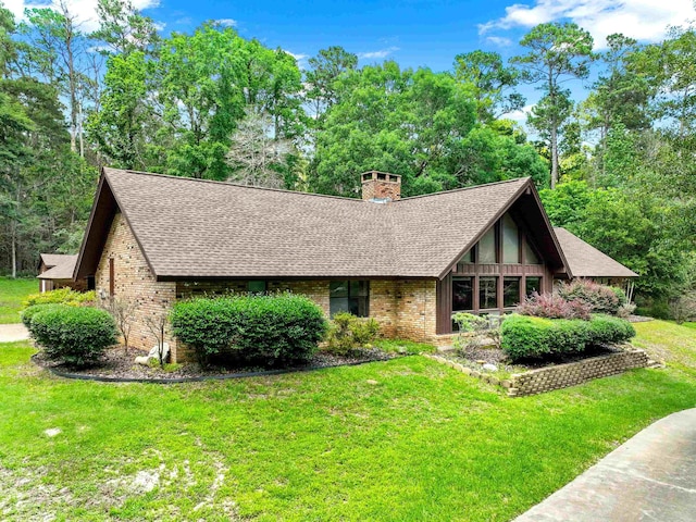 tudor home with a front yard