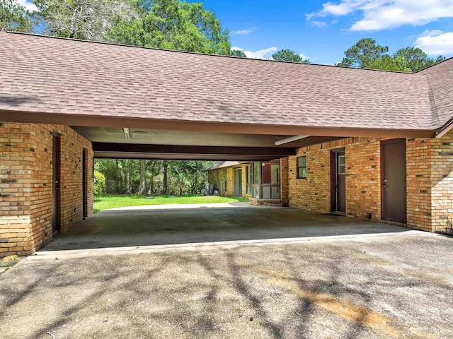 exterior space with a carport