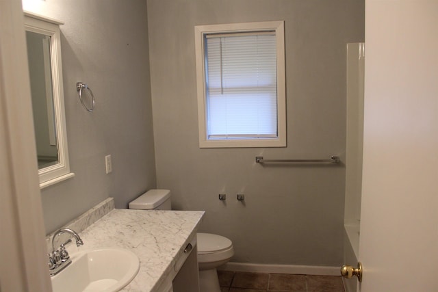 bathroom with tile patterned floors, vanity, and toilet