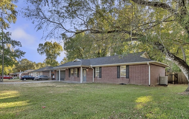 single story home with central AC and a front yard