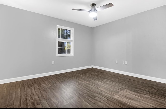 empty room with ceiling fan and dark wood-type flooring