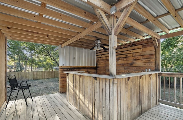 wooden deck featuring ceiling fan