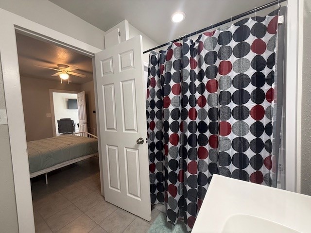 bathroom with a shower with curtain, ceiling fan, and tile patterned floors