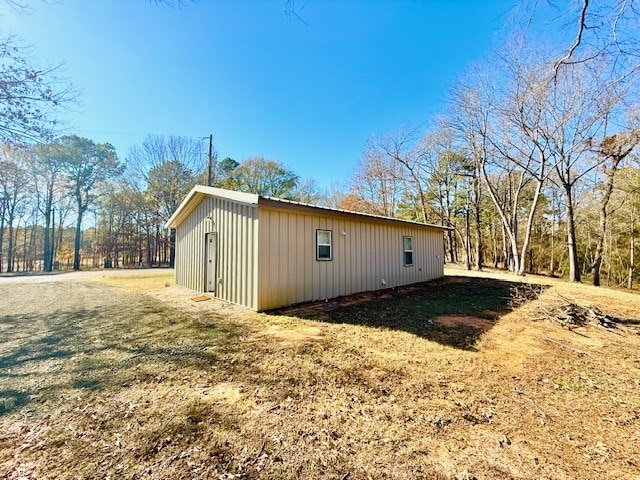 view of outdoor structure with a lawn