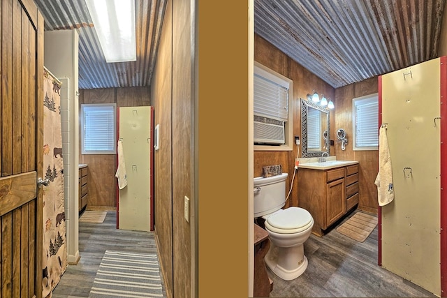 119 W Creekside Dr, Hemphill, TX 75948 - full bath with wood finished floors, toilet, wood walls, and vanity
