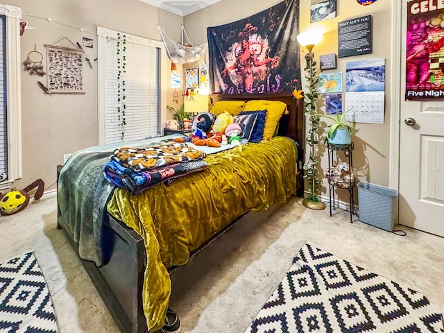 bedroom featuring carpet floors and ornamental molding