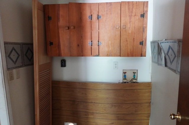 718 Pinewood, Diboll, TX 75941 - laundry room with cabinet space, hookup for a washing machine, and hookup for an electric dryer